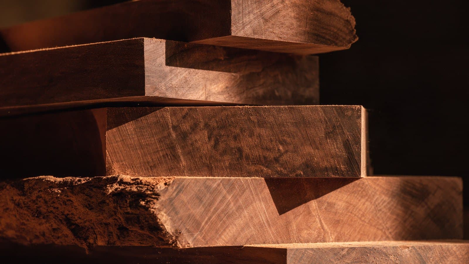 Walnut offcuts sitting on a workshop shelf